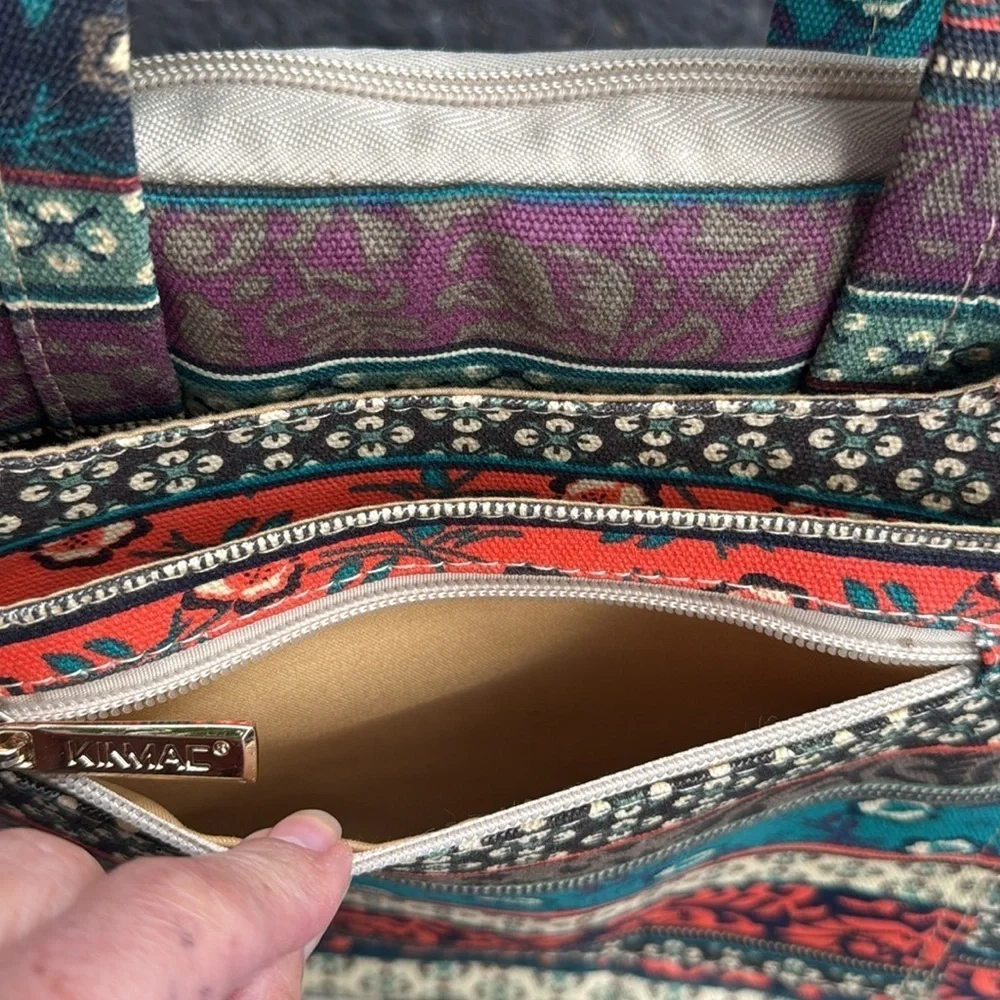 Kinmac bohemian vibe fabric multi pocketed zipper closure laptop/tablet bag.